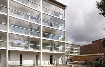 A new block of houses with glazed balconies.