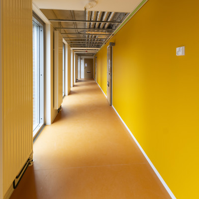 A yellow corridor in a new house.